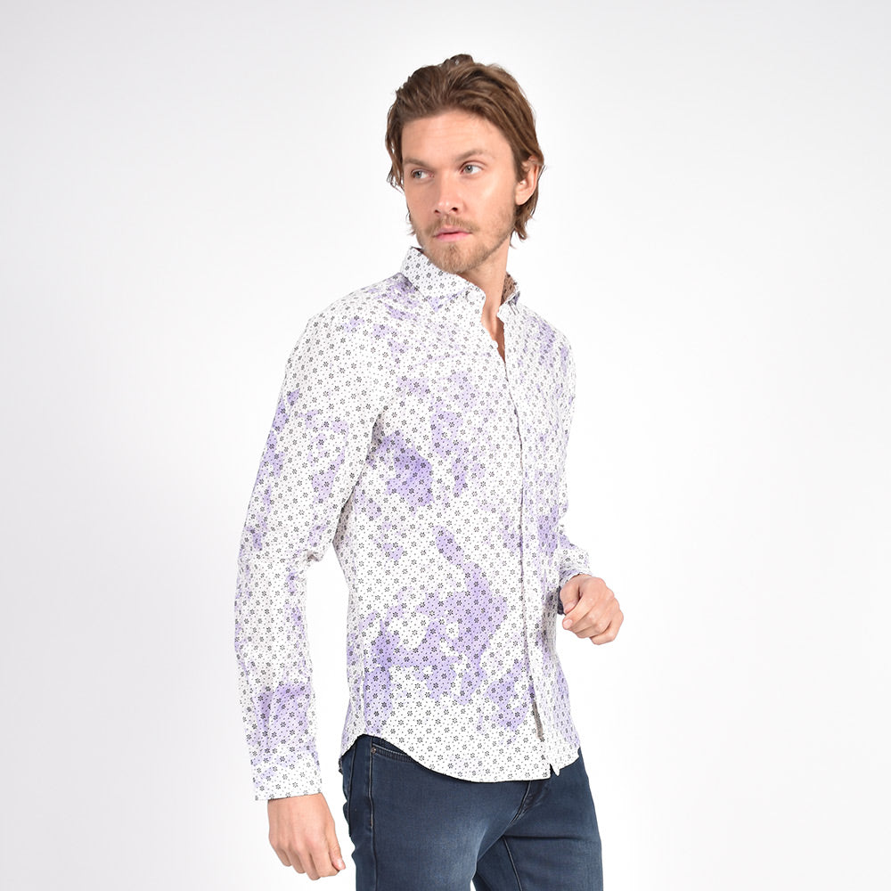 Model in long-sleeve, white linen button up with lilac tie-dye finish and calico print. 