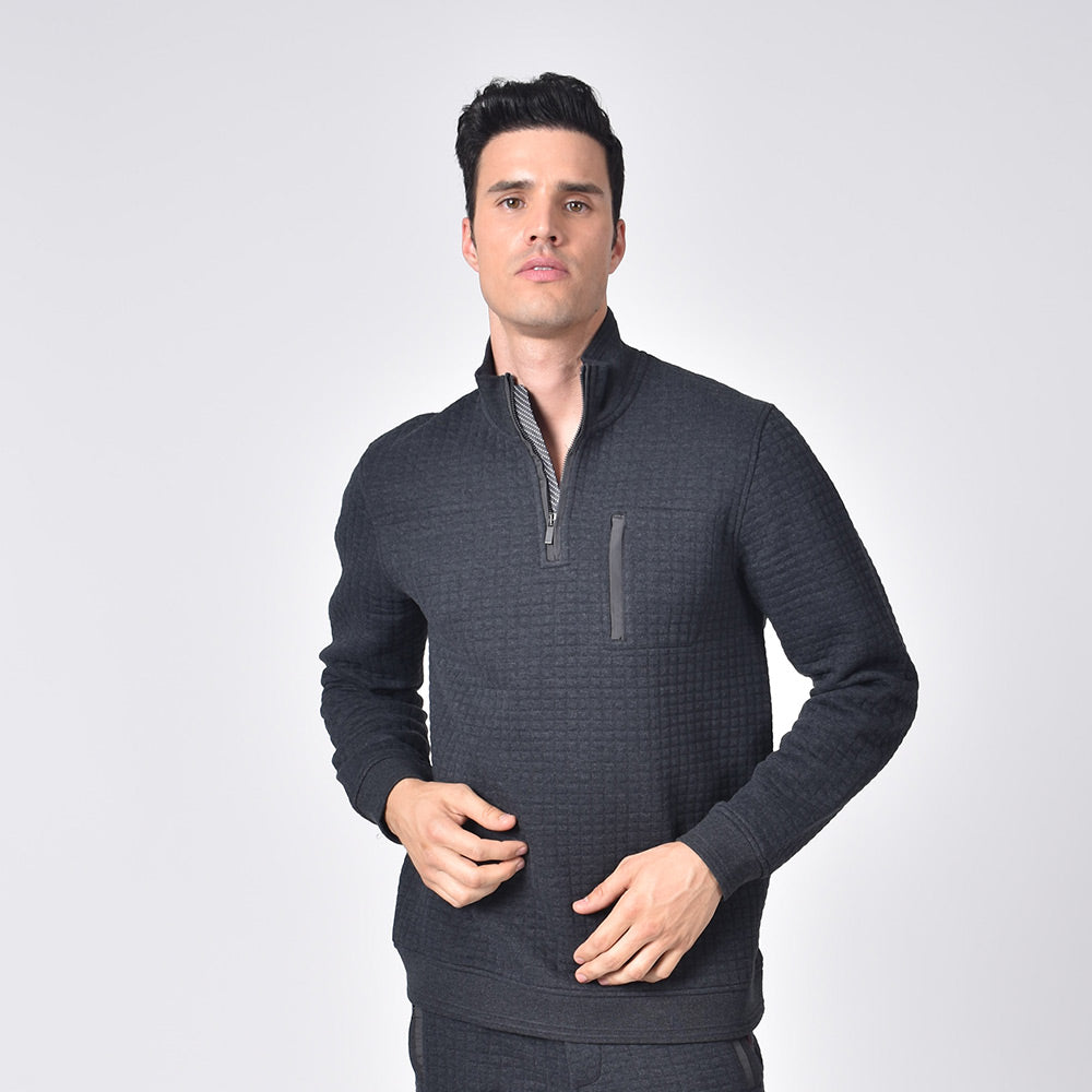 Model in grey, quilted track jacket with hidden half front-zipper and chest-pocket.