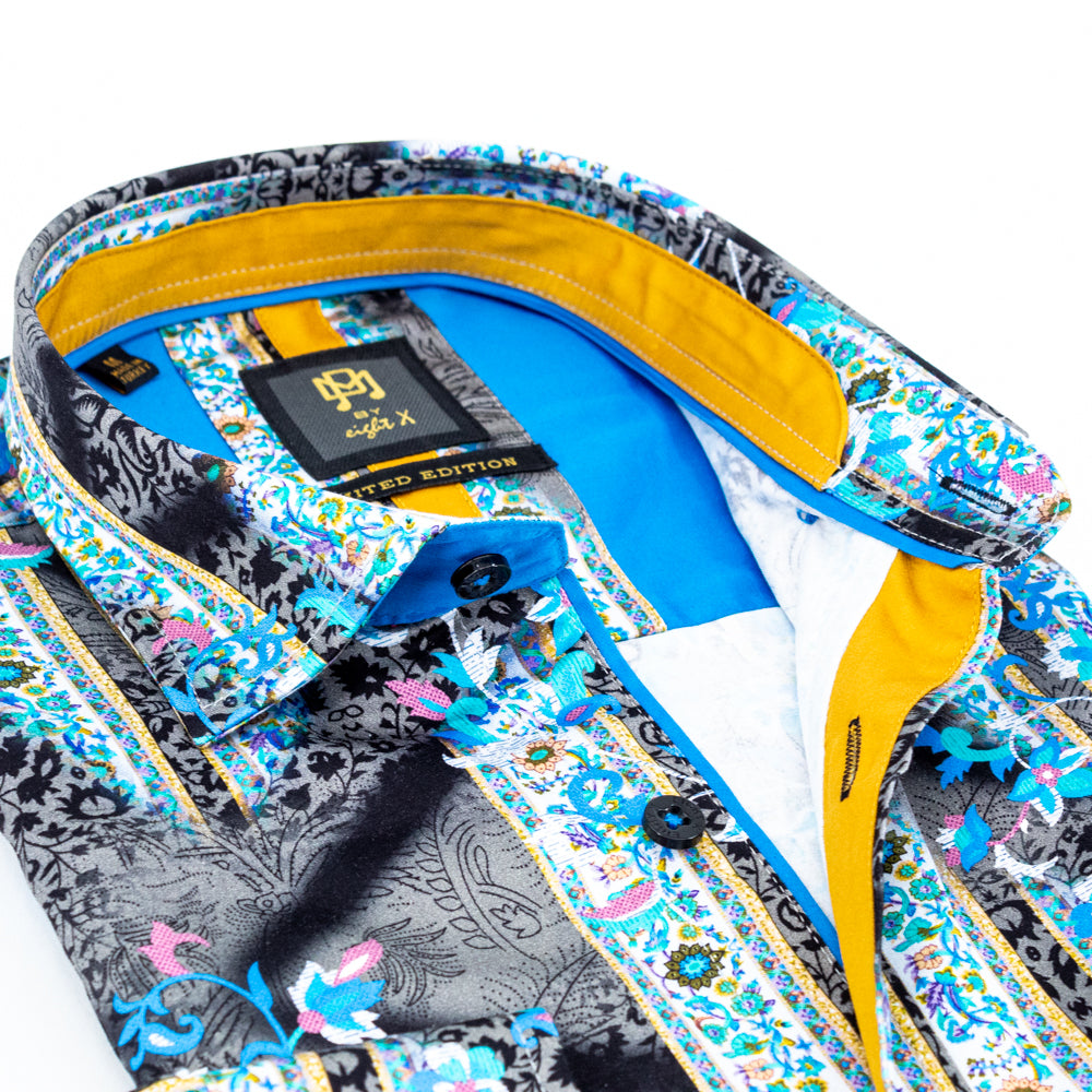 close up collar of blue and gold floral shirt