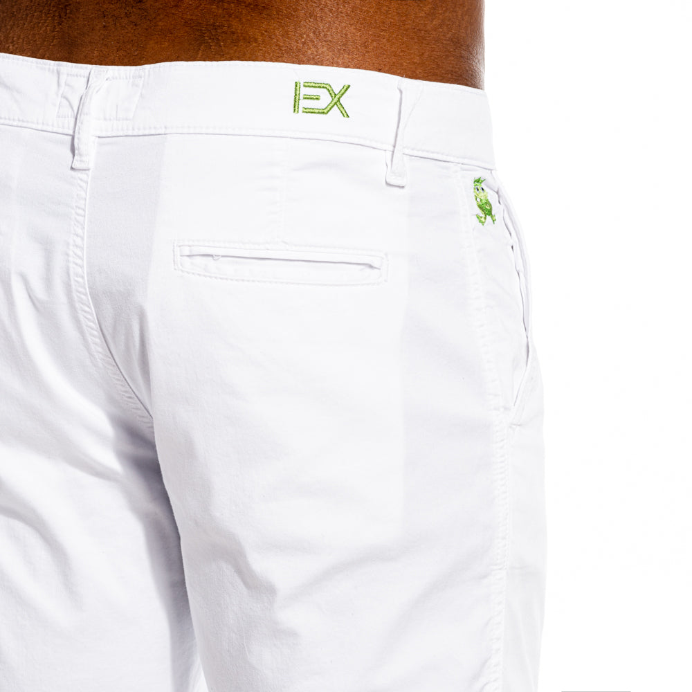 Detail of white chino shorts’ backside. Green embroidered “EX” logo by back belt loop, and buttonless welt pocket. 