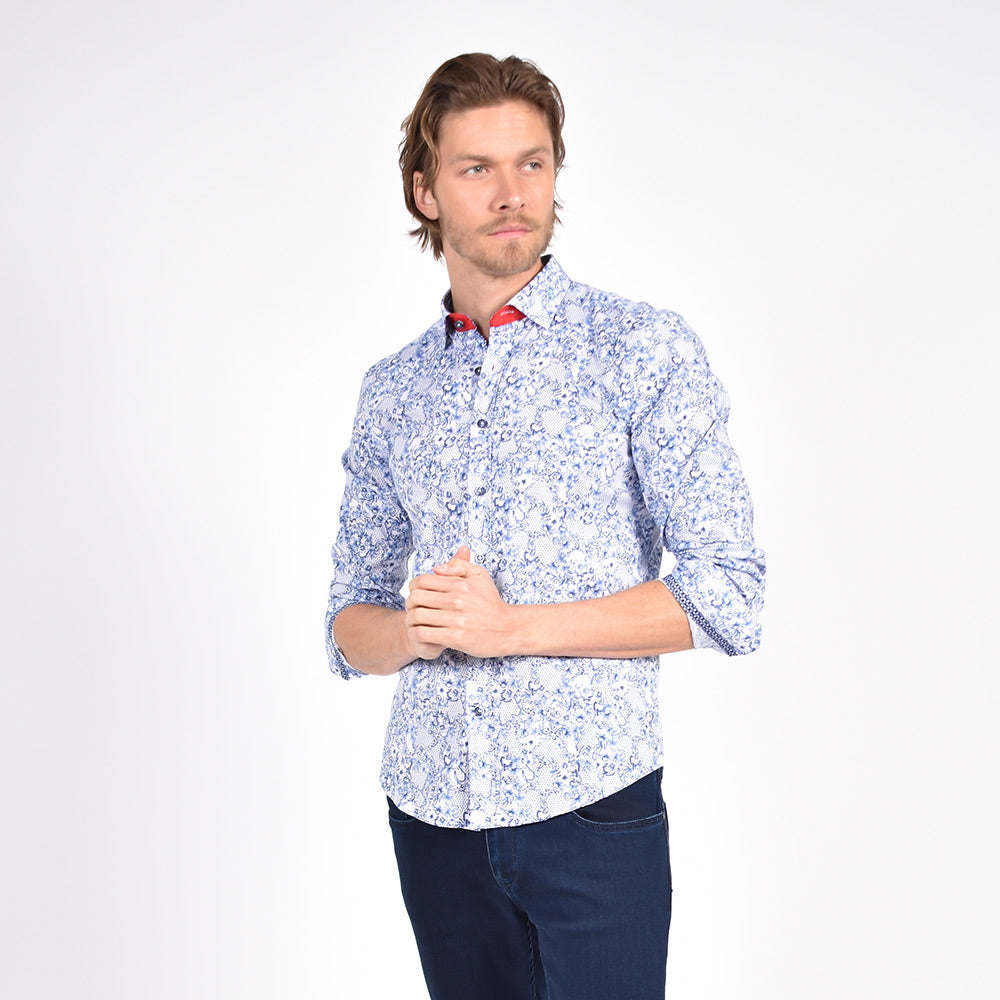 Model in navy and white baroque floral print button-up.