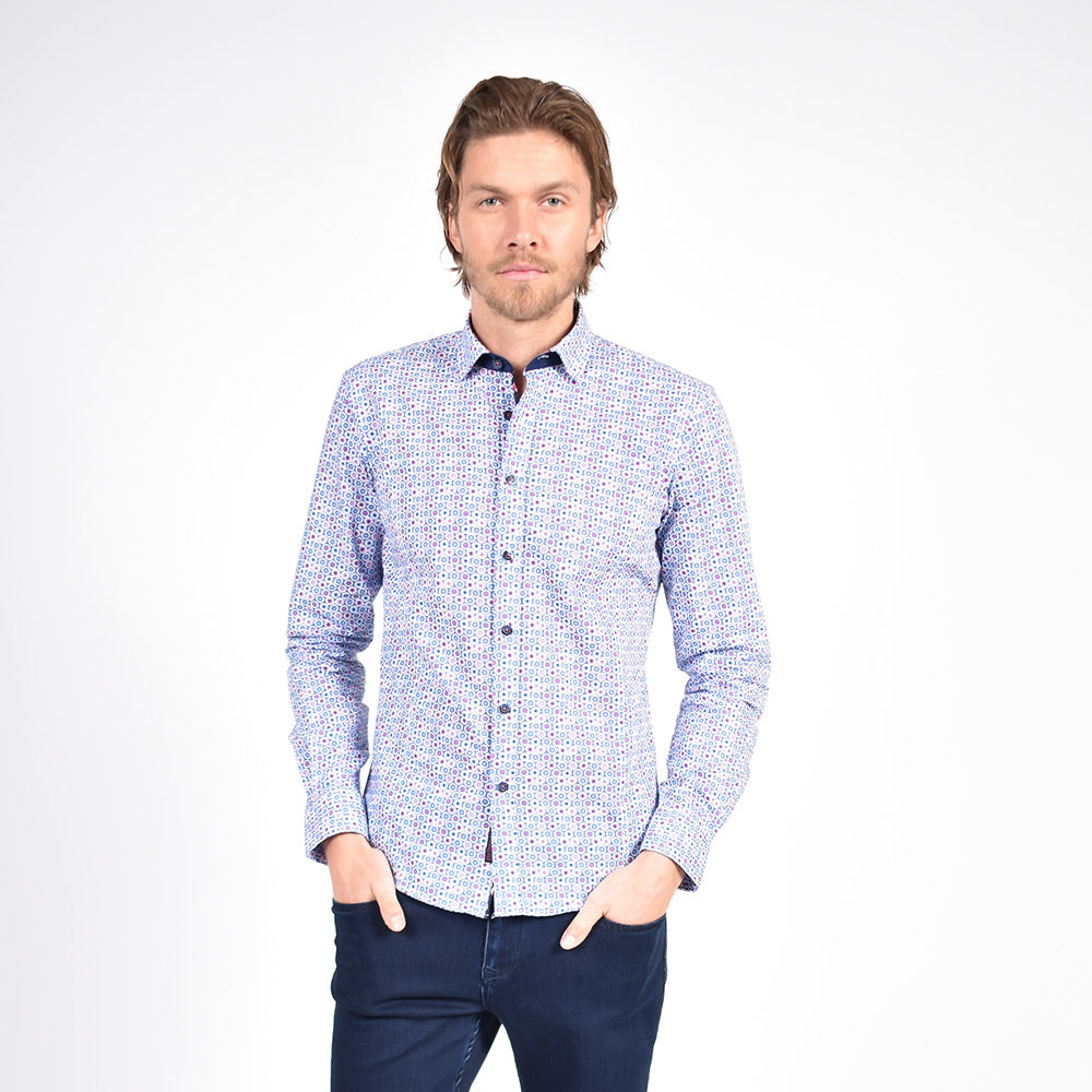 Model in light-blue button-up with small floral print.