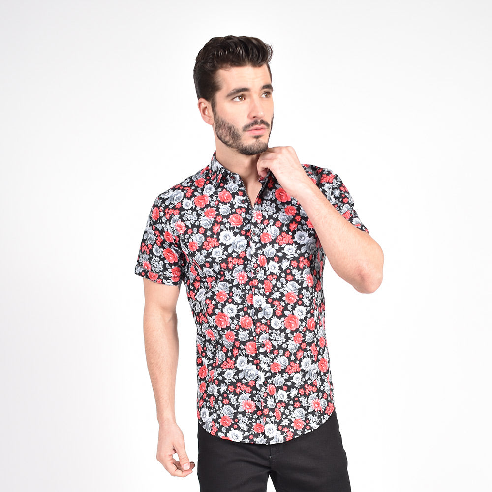 Model in short-sleeve black button-up with red and grey floral print.