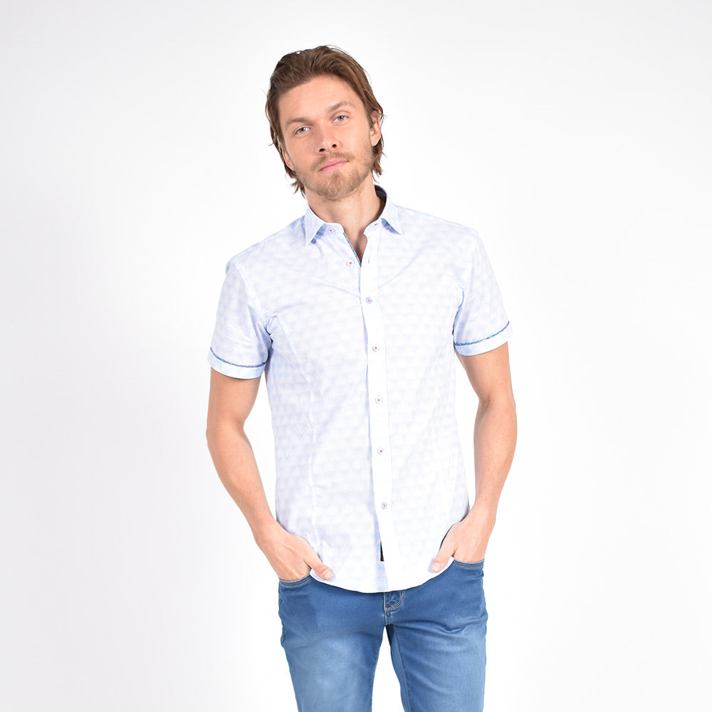 Model in short-sleeve, powder-blue button up.