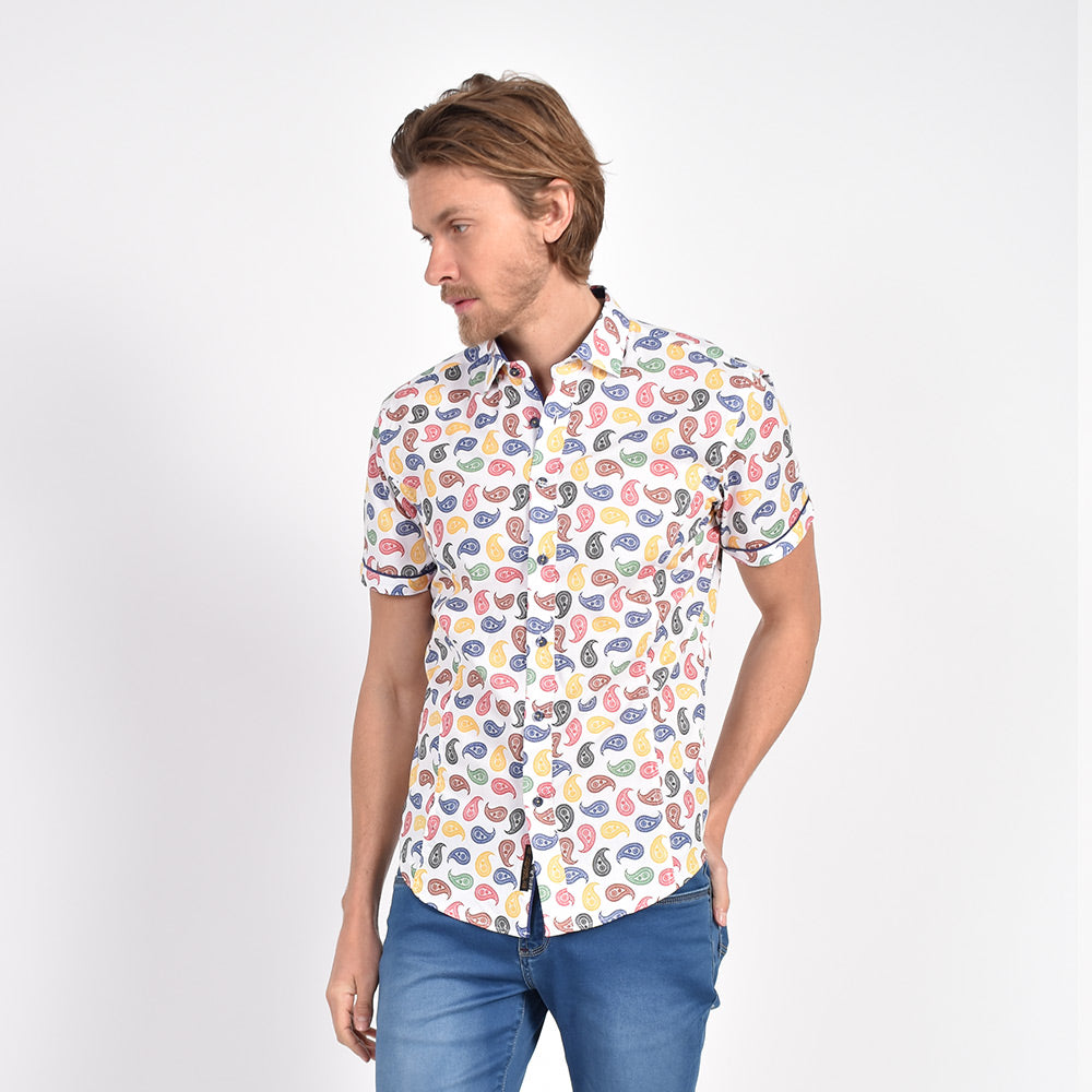 Model in short-sleeve white button-up with multi-color paisley print.