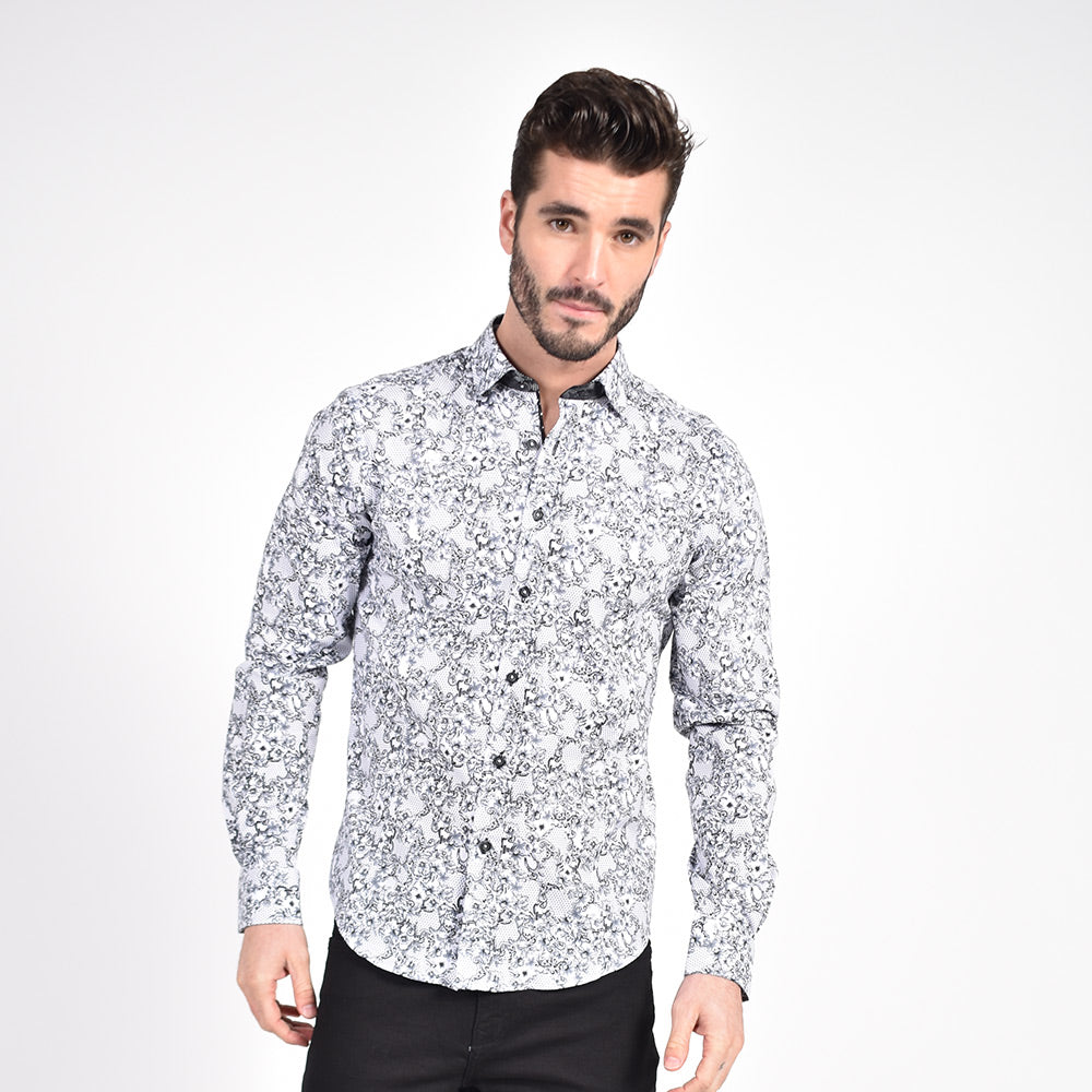 Model in grey-scale, baroque floral print button-up.