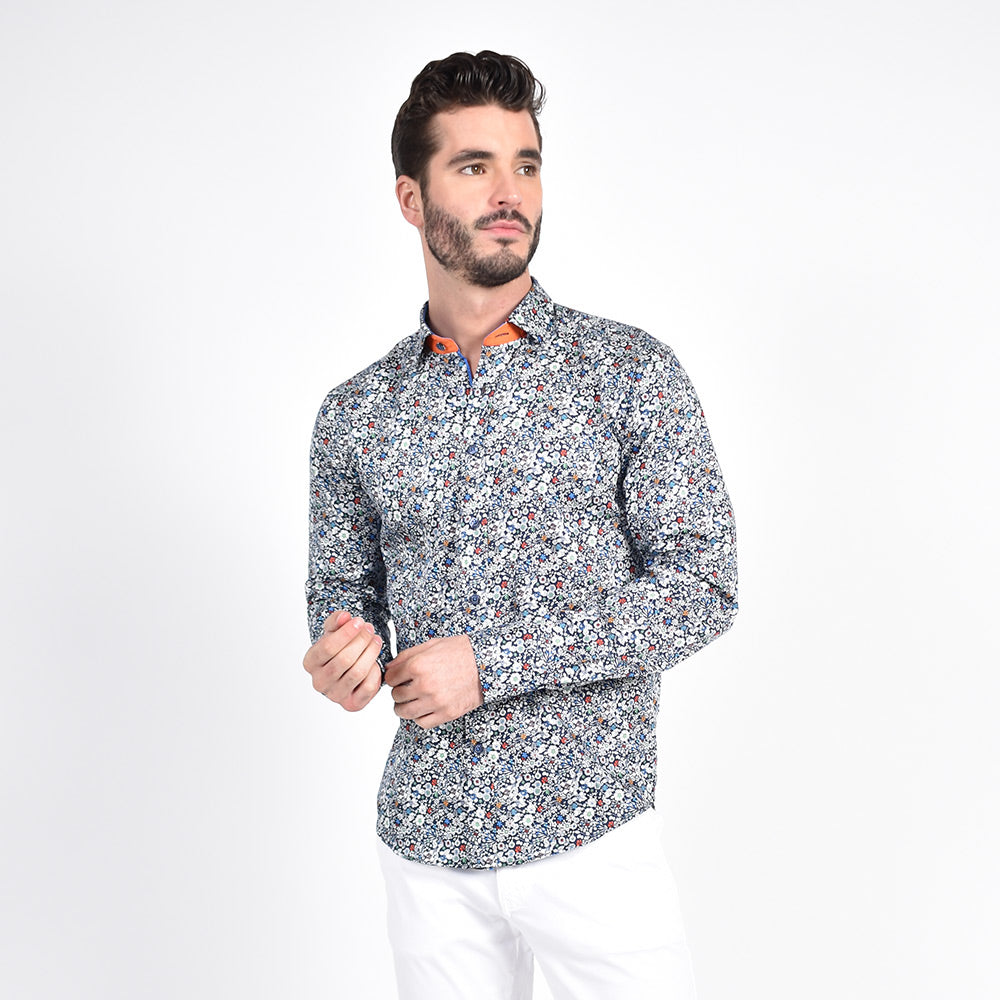 Model in navy-blue button-up up with white floral print.
