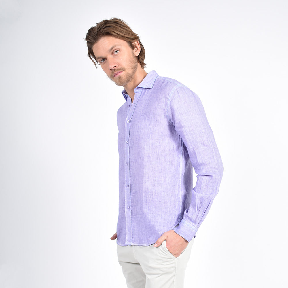 Model in long-sleeve, solid purple linen button-up. 
