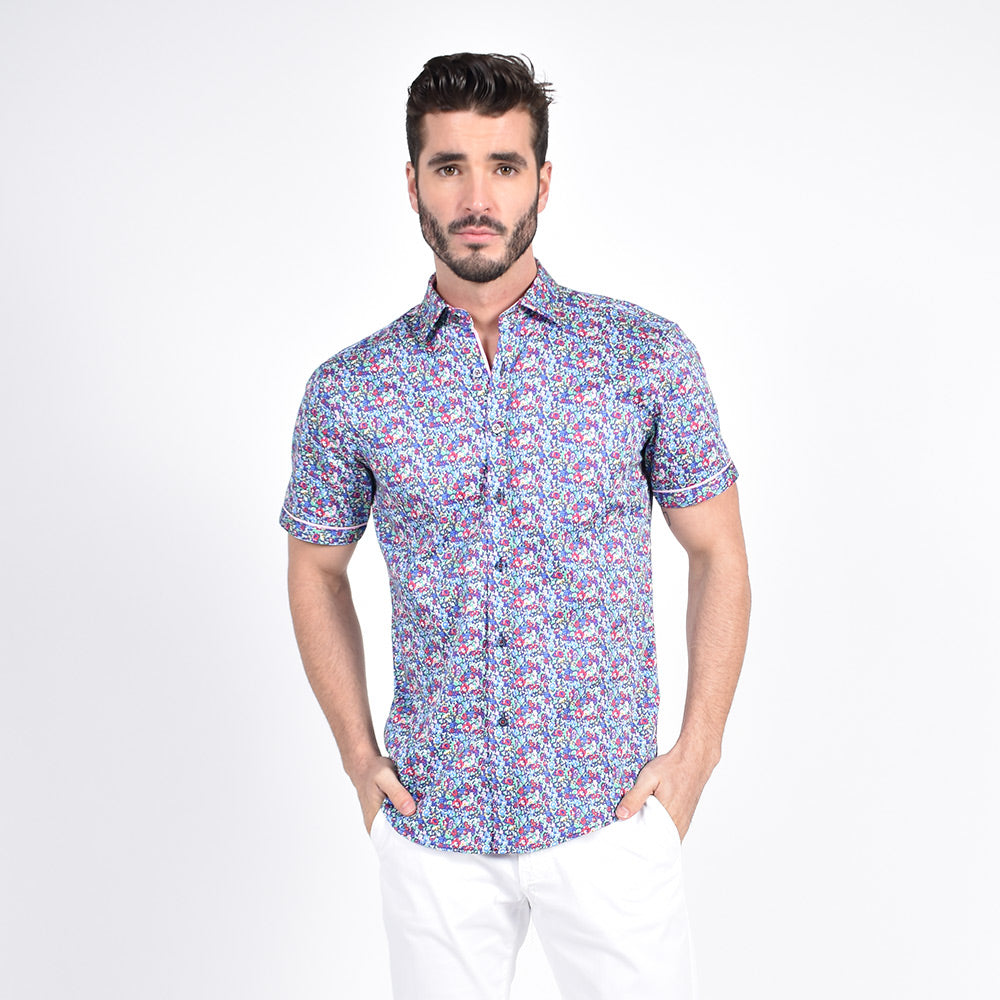 Model in short-sleeve multi-colored floral button up.