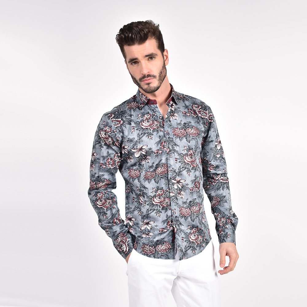 Model in gray button-up with oxblood floral print.