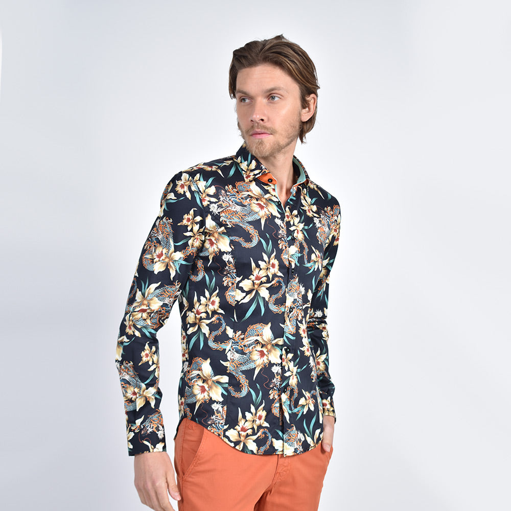 Model in black button-up with large iris and dragon digital print.