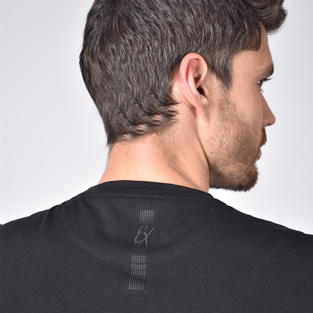 Silicone "8X" logo on back of t-shirt.