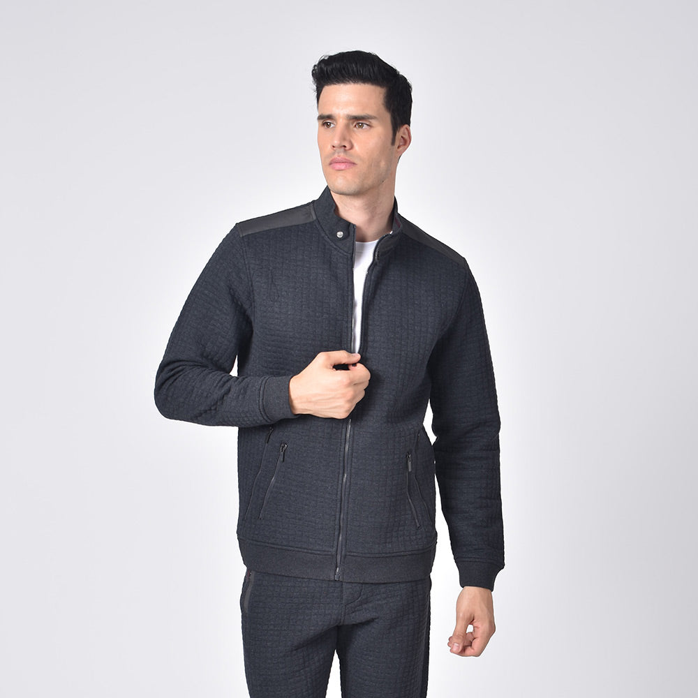 Model in grey, quilted moto jacket with full front-zipper, double zip pockets, and snap-button collar. 