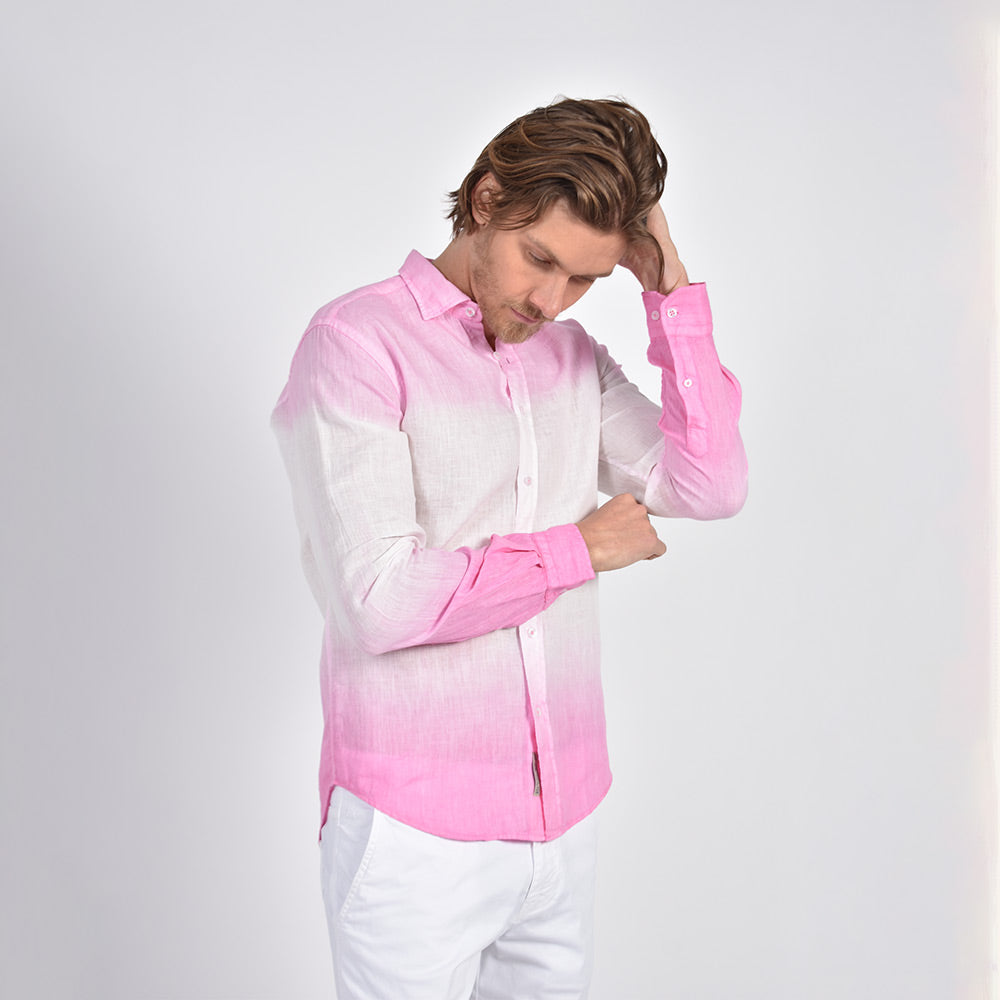 Model in white, long-sleeve linen button up with pink dip-dye effect. 