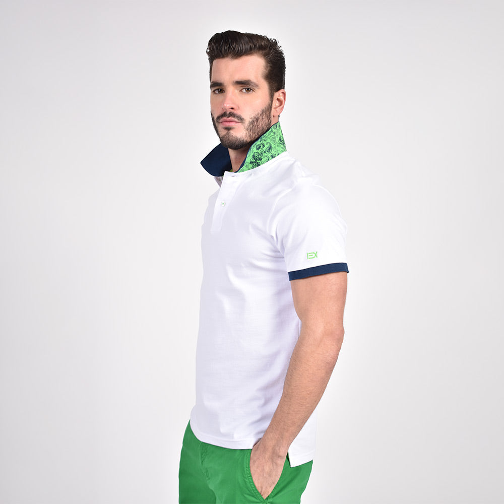 Model in white polo with reversible green and paisley reversible collar.