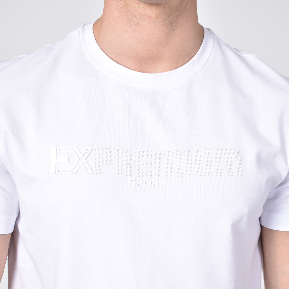 Detail of silicone "EX Premium Sport" logo on front of shirt. 