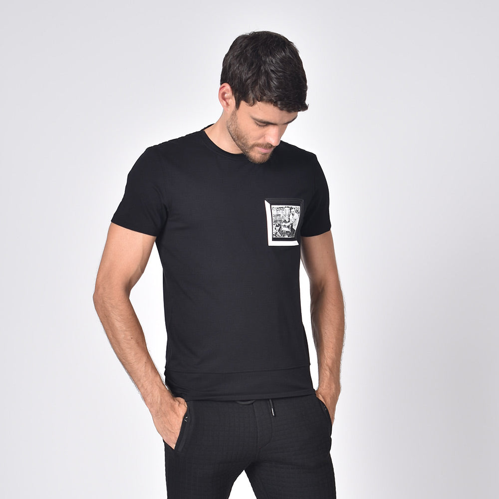 Model in black, short-sleeve cotton crew-neck with black and white chest-patch of biker. 