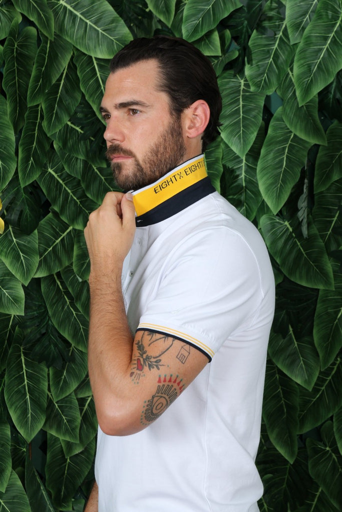 Detail of reversible collar: yellow on reverse with white contrasting stripe and navy Eight-X logo design.