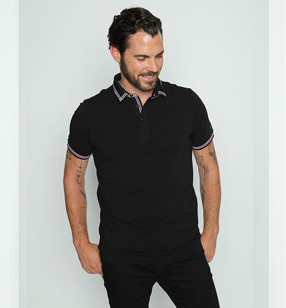 Black polo with tipped collar; two-button, lilac-trimmed placket; and striped, ribbed armbands.