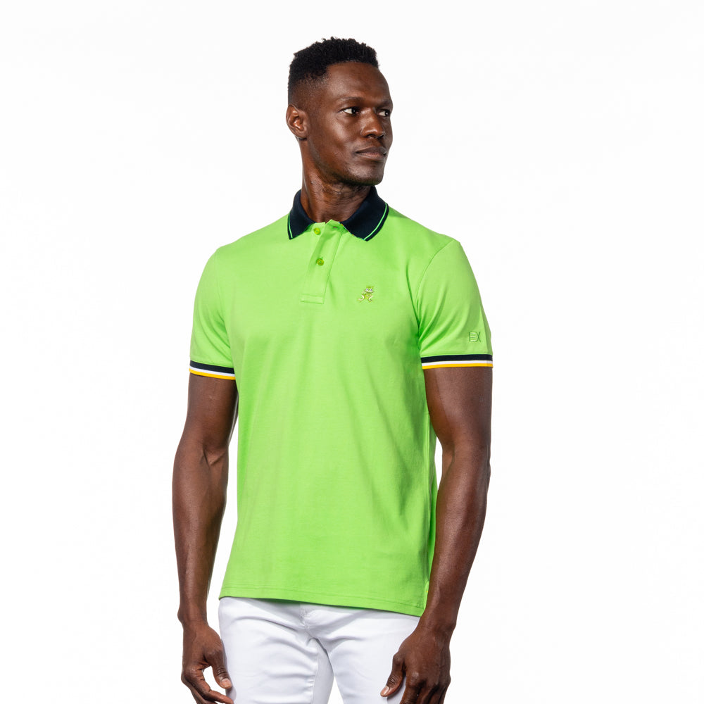 Model posing in bright green polo with navy collar, striped armbands, and embroidered green frog mascot. 