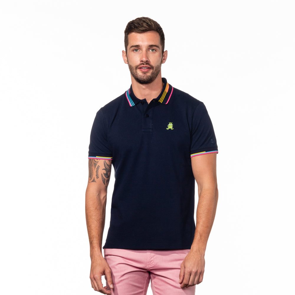 Model wearing navy polo with striped collar.