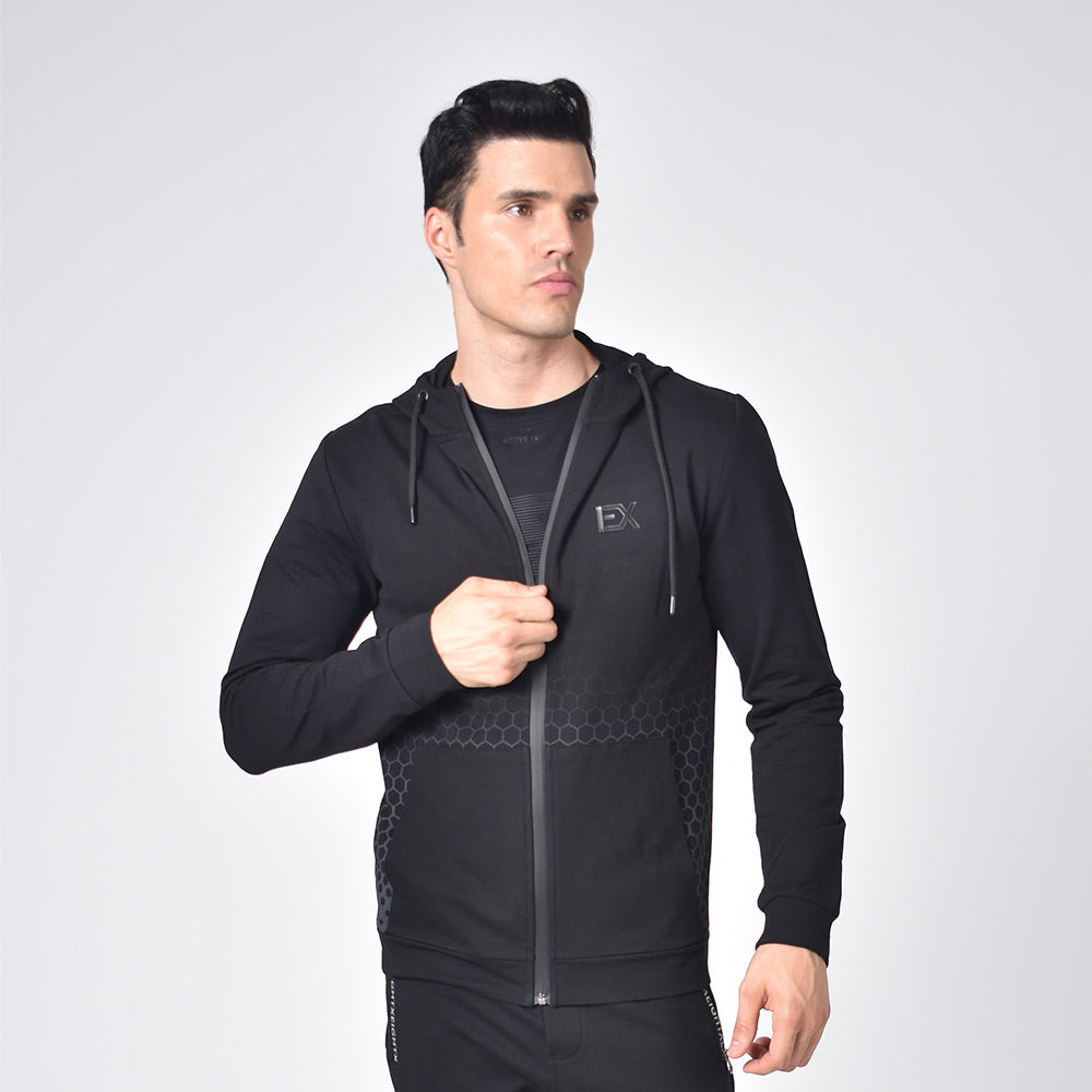 Model in black cotton hoodie with drawstring hood; gradient honeycomb print; full front-zip; front pockets; and silicone “EX” logo on chest.