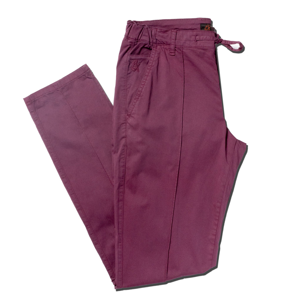 Folded syrah chino pants with drawstring waist with a stitch going down the middle of the legs