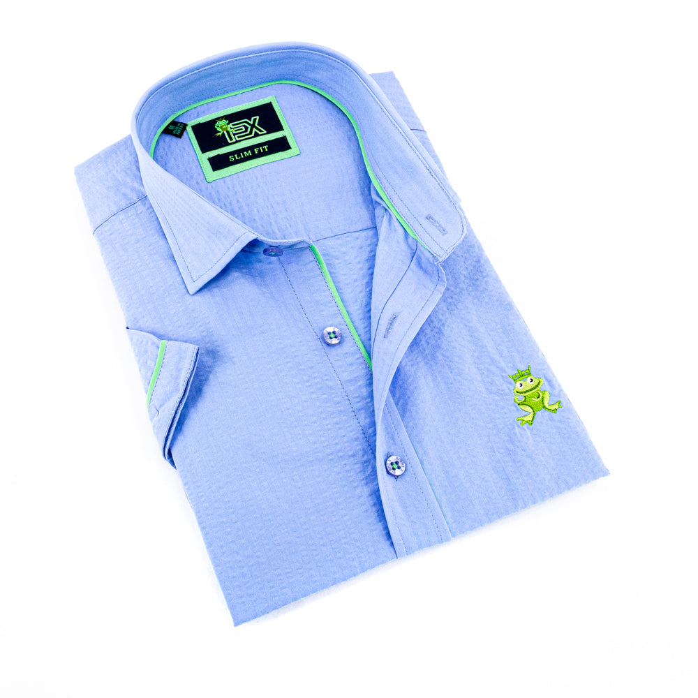 Folded short-sleeve, light-blue seersucker button up with green trim; green, embroidered frog; and blue buttons.