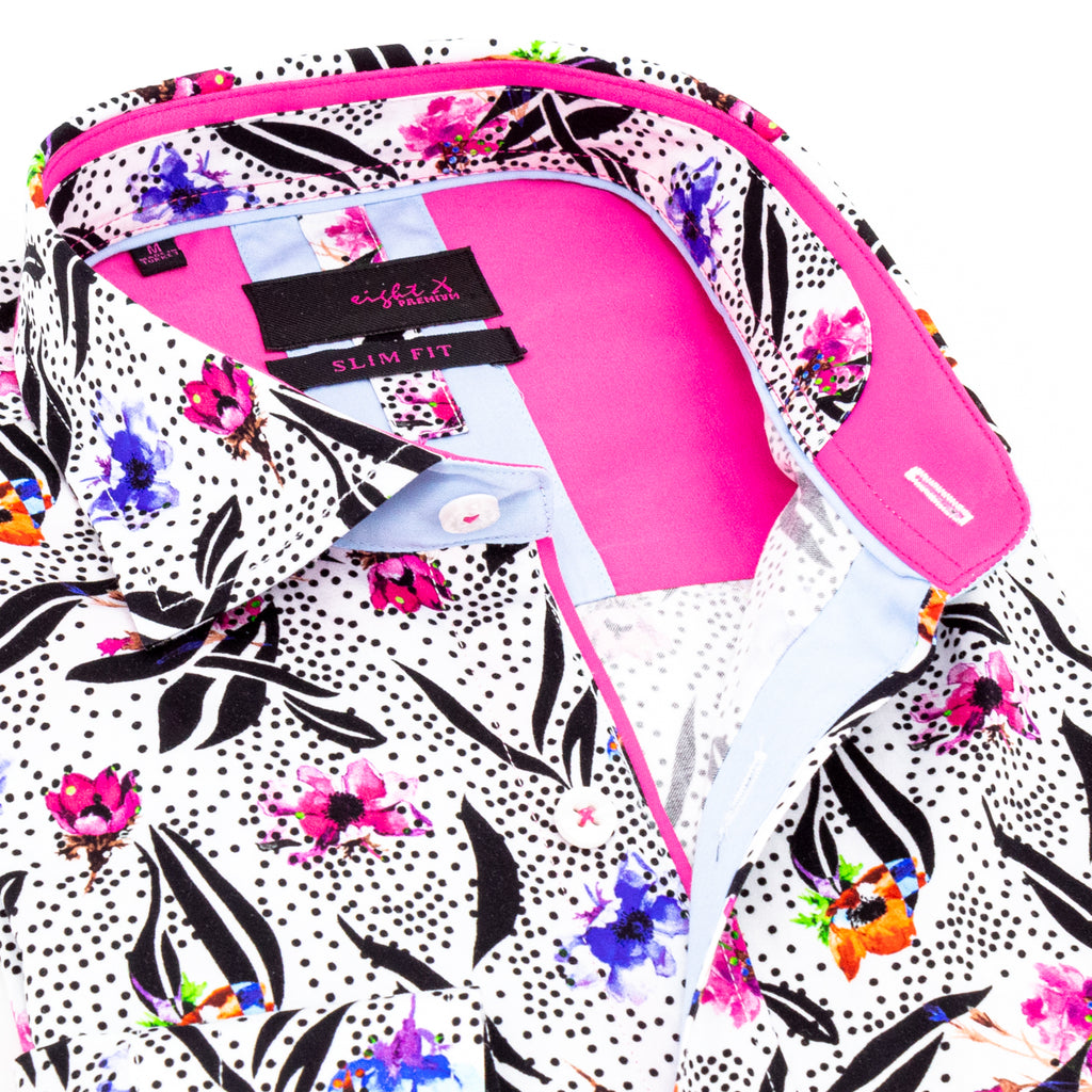 Close-up of colorful floral button down shirt with white base and pink lining in the collar and inside of the shirt