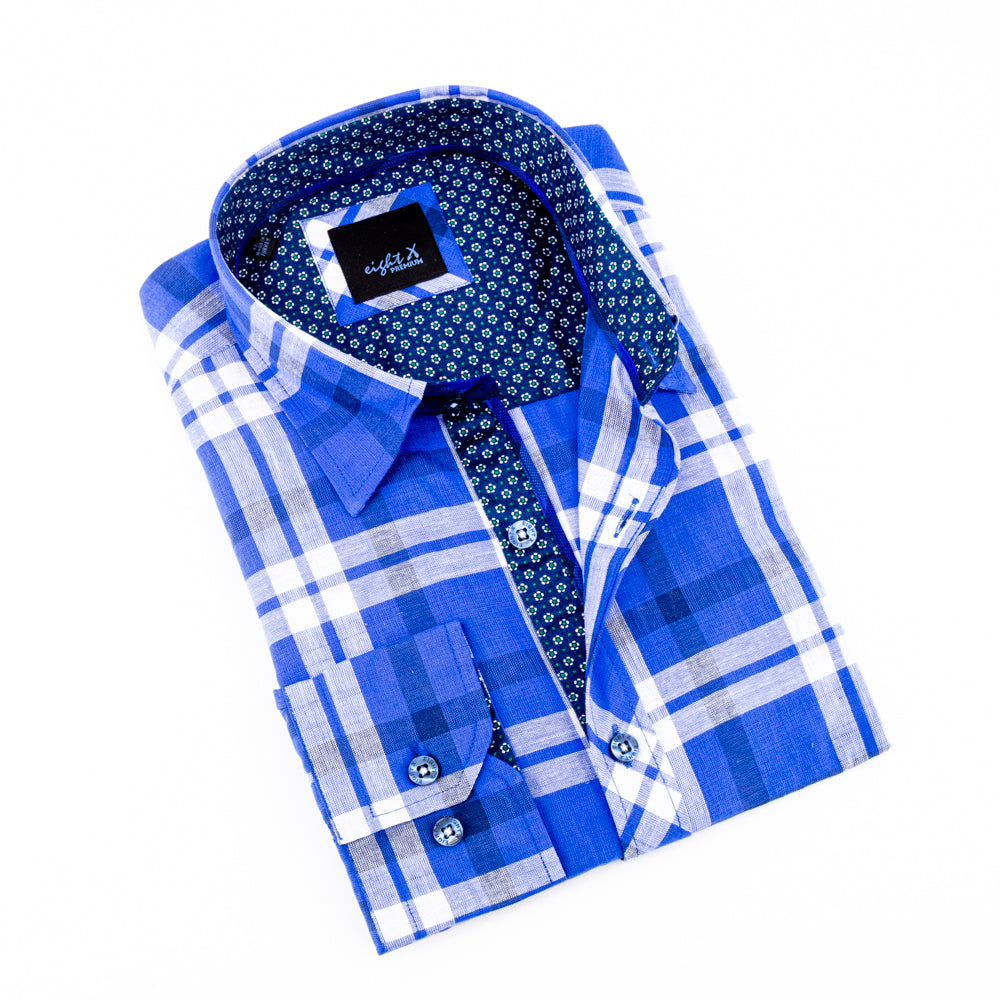 Folded long-sleeve, blue linen button-up with plaid patterns and royal-blue calico trim. Includes light-blue buttons and spread collar. 