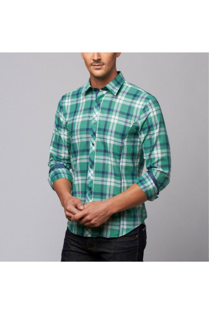 Model in green plaid linen button up with royal-blue calico trim.