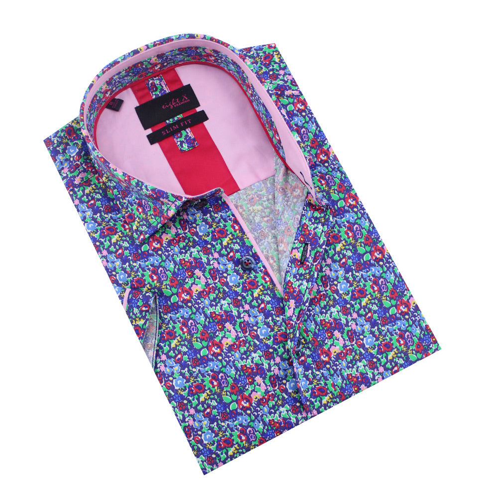 Folded short-sleeve button up with multi-color floral print design in blue, violet, fuchsia, pink, and green. Features fuchsia and pink trim.