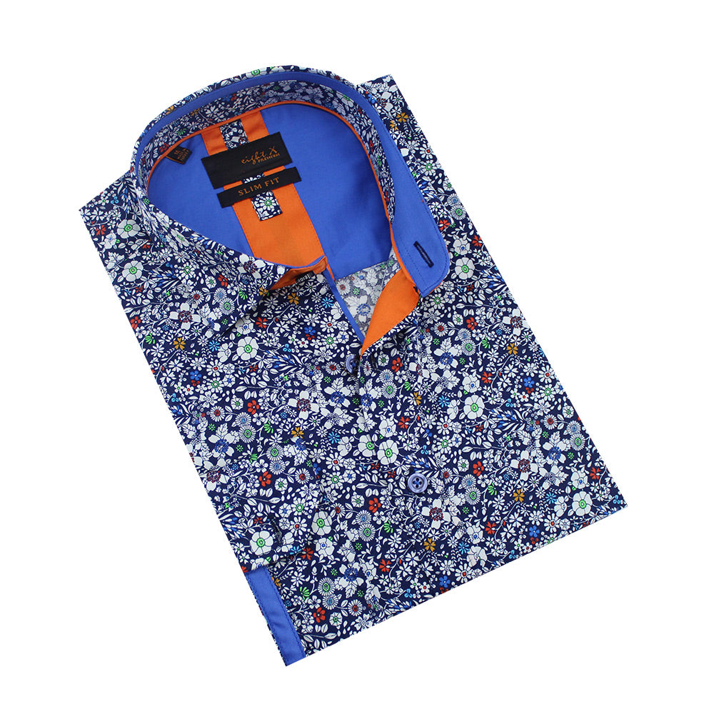 Folded navy-blue button-up with white floral print and blue front-yoke.