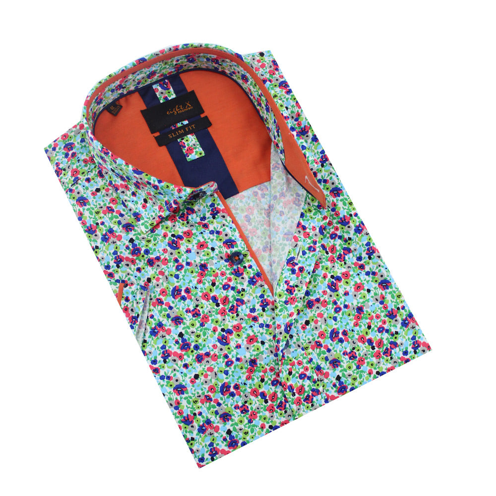 Folded white button-up with multi-color small floral print and orange trim.