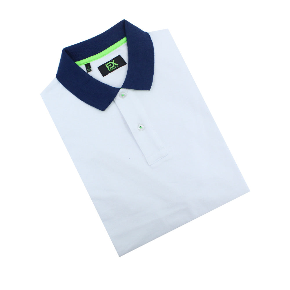 Folded white polo with two-button placket and navy-blue collar.