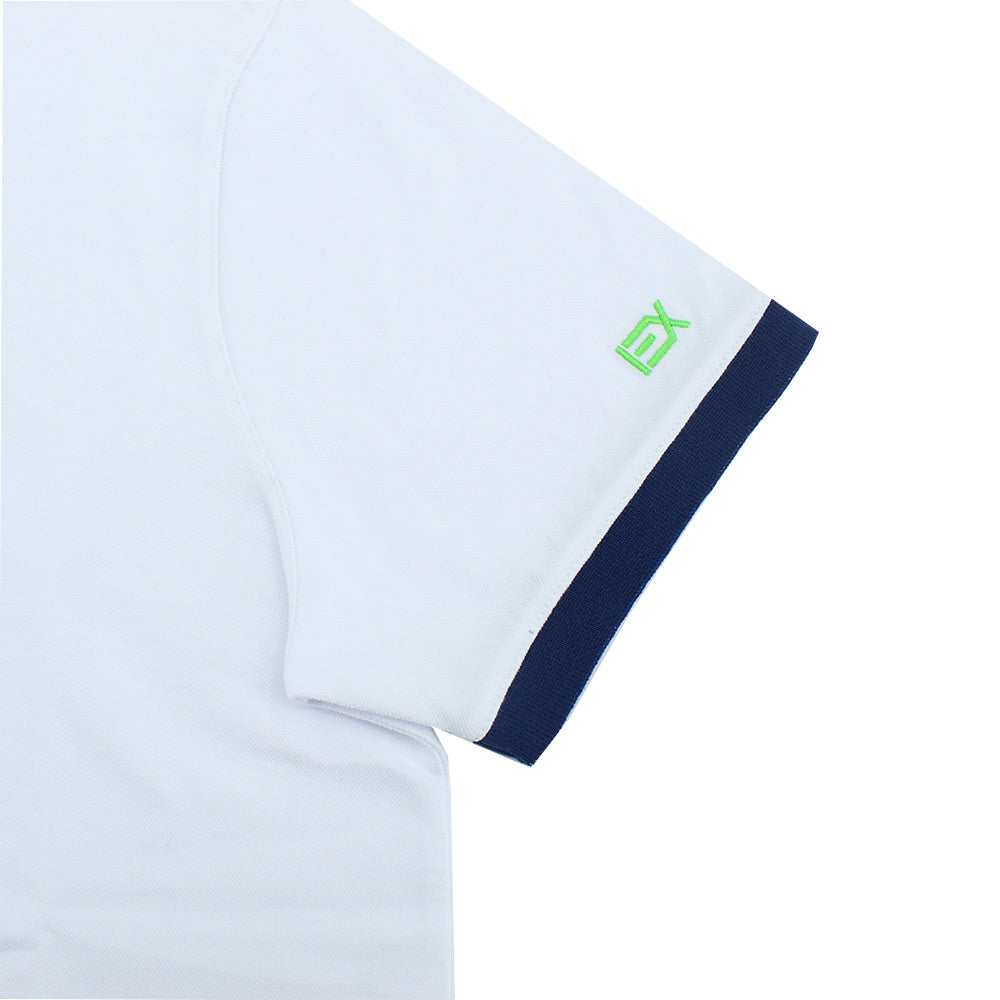 Detail of embroidered green EX logo on sleeve.