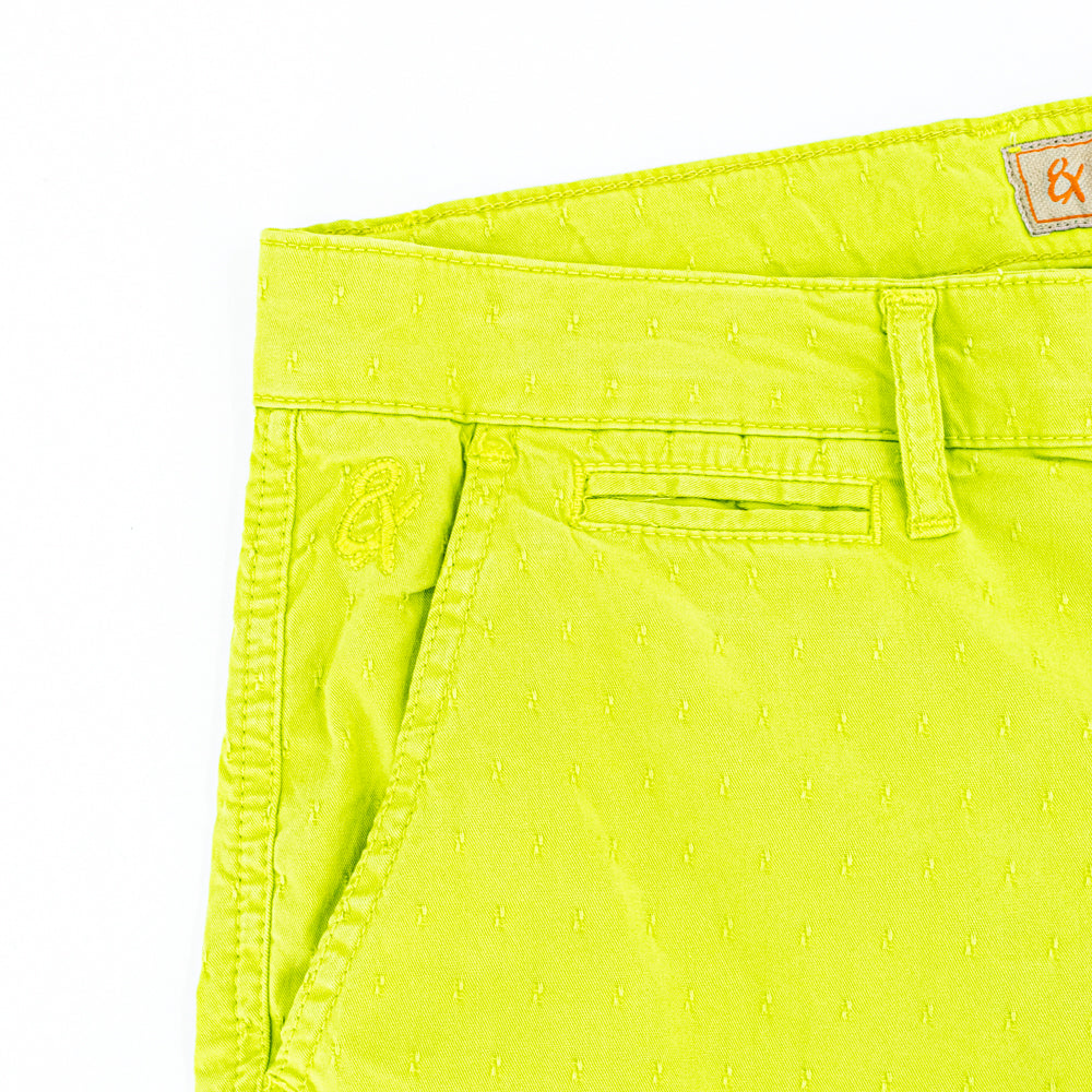 Detail of jacquard texture and embroidered logo on front right-pocket.