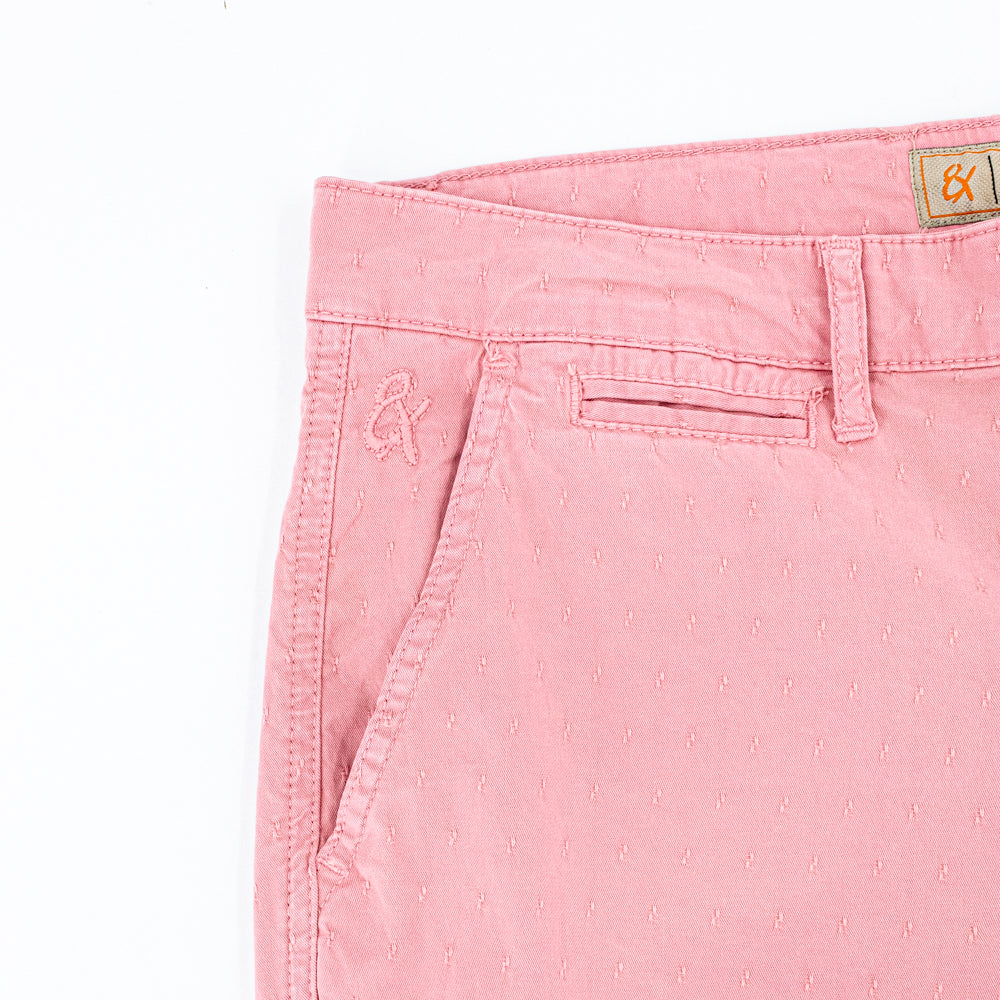Detail of jacquard texture and embroidered logo on front right-pocket.