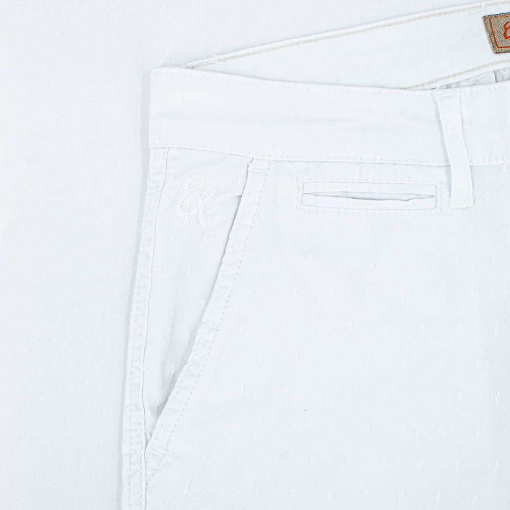 Detail of jacquard texture and embroidered logo on front right-pocket.