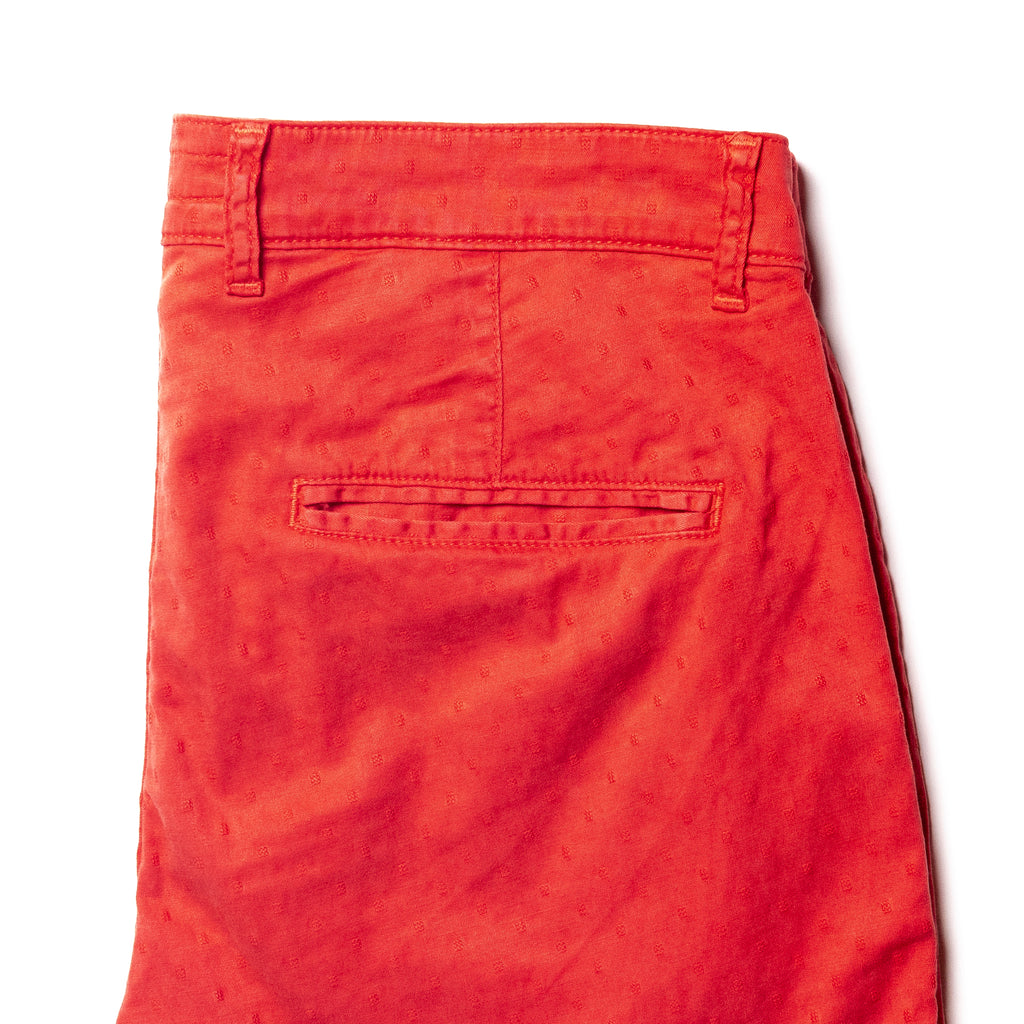 back of red jacquard textured shorts