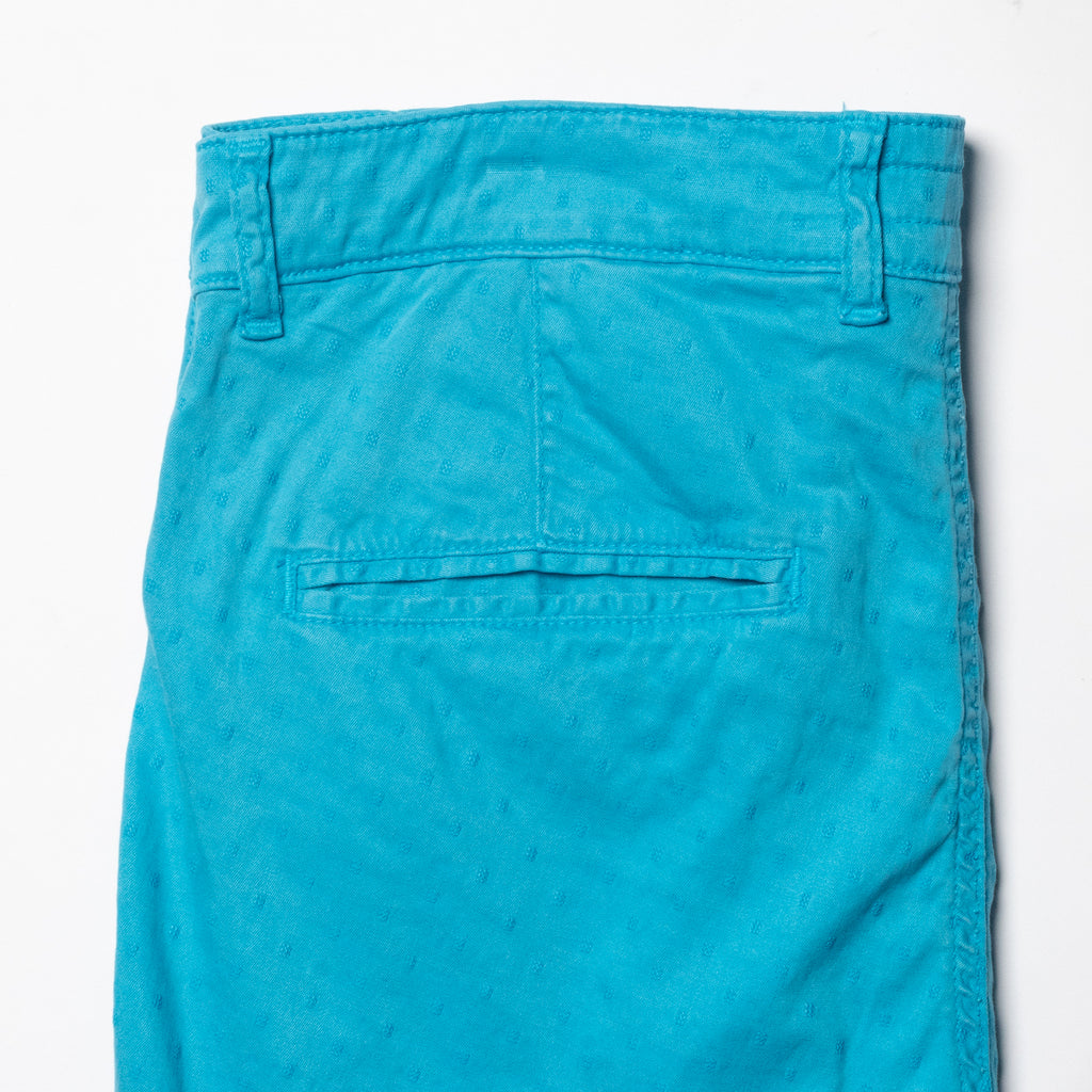 Back pocket view of turquoise jacquard textured shorts