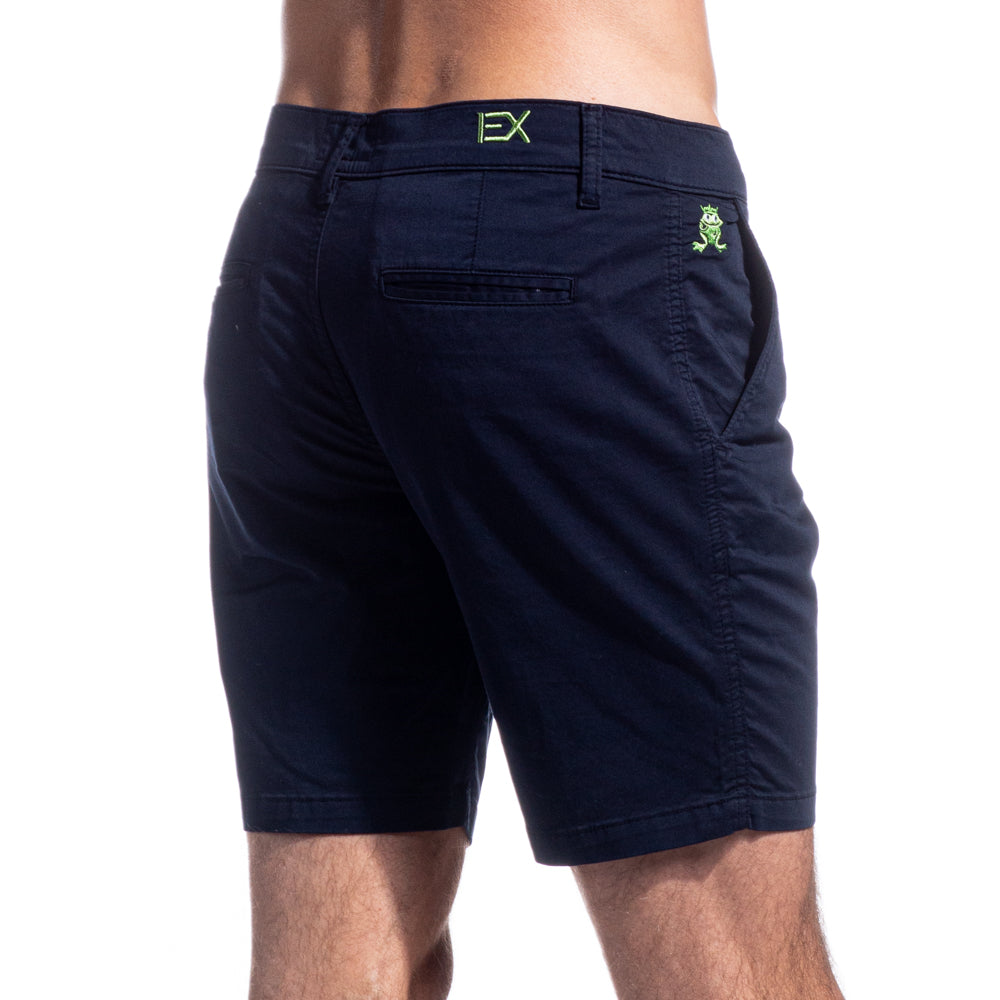 Model Wearing Navy Blue, Slim Fit Chino Shorts. Back Angled View.