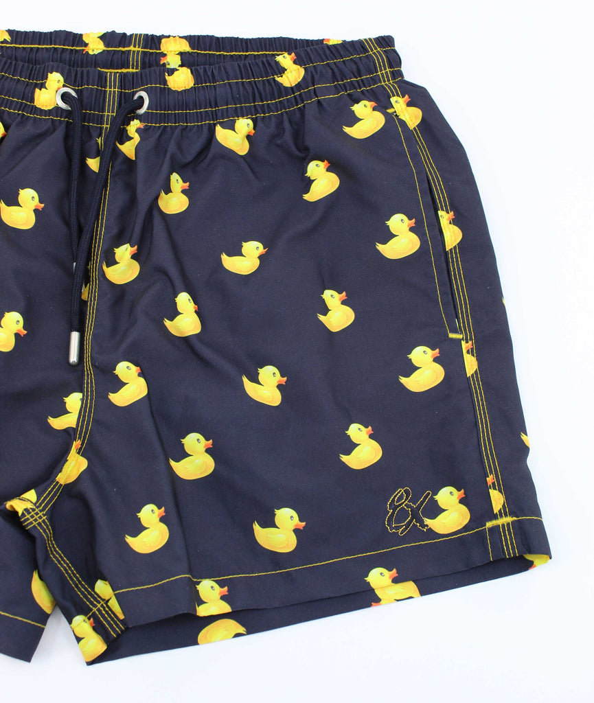 Men's navy blue swim trunks with yellow rubber duckie print