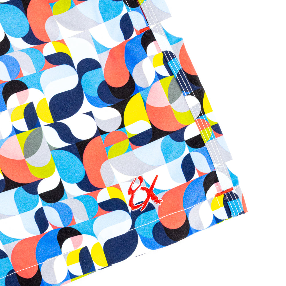 Colorful Geometrical Printed Swim Trunks. Up Close of Logo Embroidery.