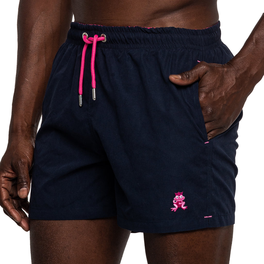 Navy polyester swim shorts with magenta draw strings and frog logo