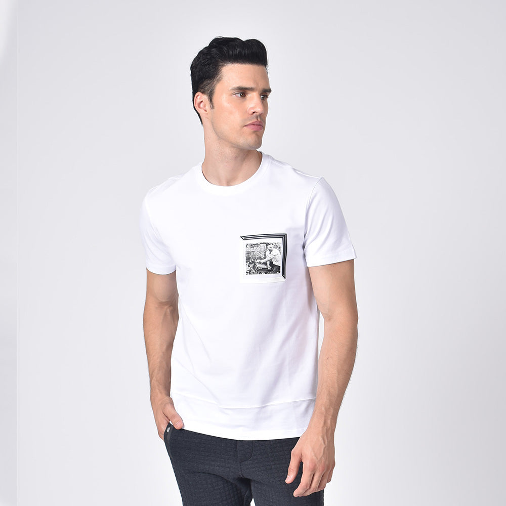 Model in white, short-sleeve cotton crew-neck with black and white chest-patch of biker. 