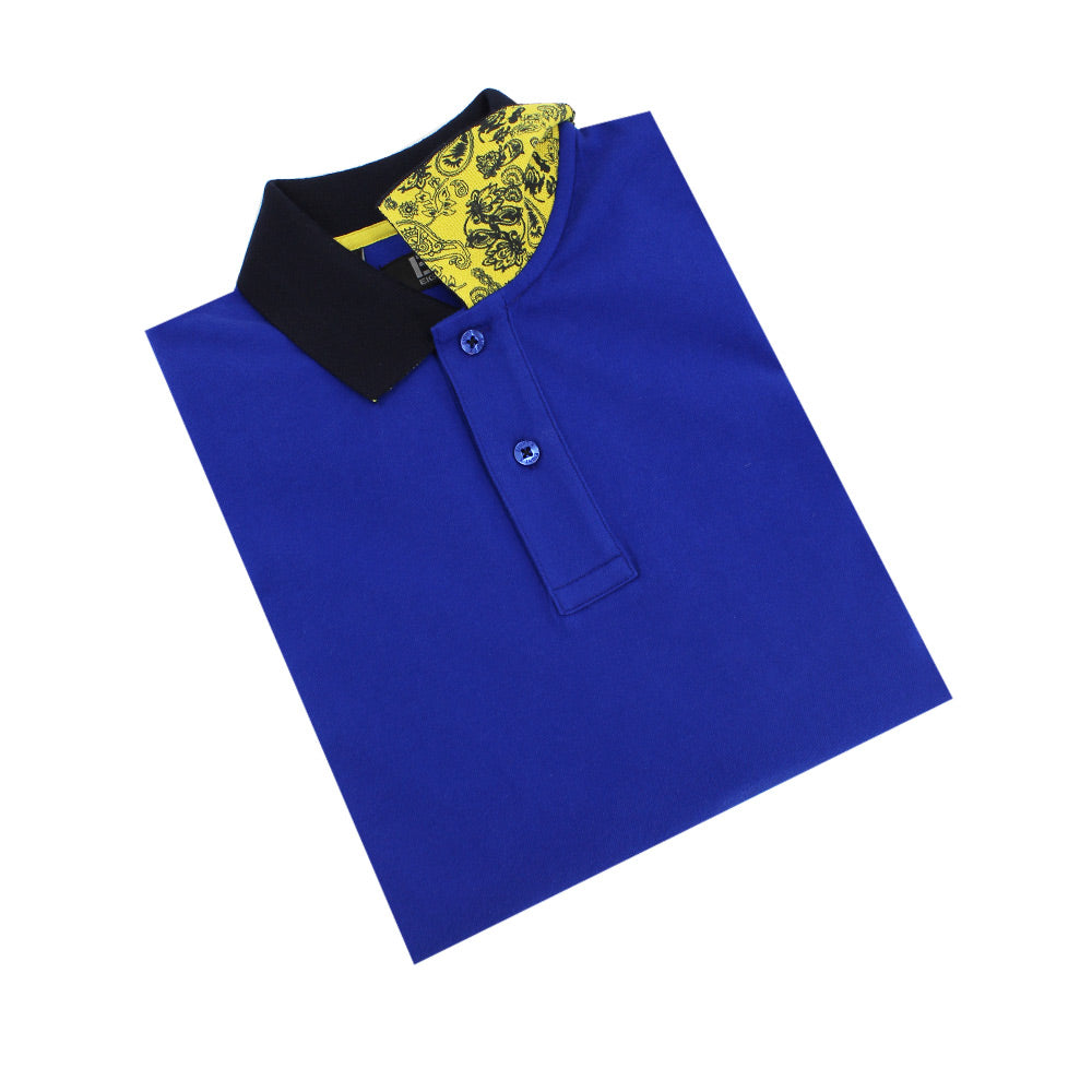 Folded royal-blue polo with navy-blue collar and reversible collar with paisley yellow print.