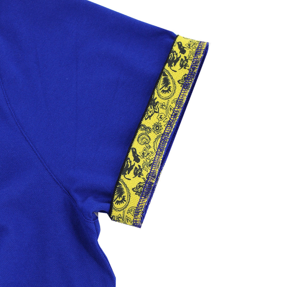 Detail of reversible ribbed armbands: yellow paisley print on reverse.
